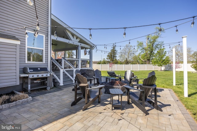 view of patio / terrace featuring a fenced backyard, a grill, and an outdoor fire pit