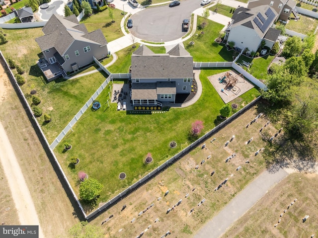 birds eye view of property with a residential view