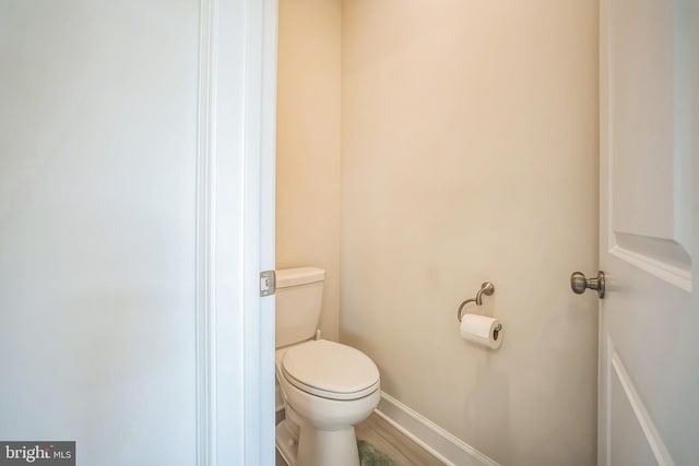 22528 Wilson View Ter, Ashburn, VA 20148 - bathroom featuring baseboards, toilet, and wood finished floors