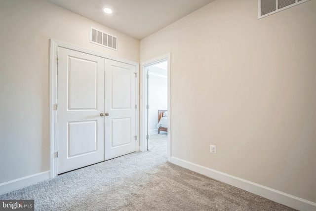 22528 Wilson View Ter, Ashburn, VA 20148 - unfurnished bedroom with carpet flooring, baseboards, visible vents, and a closet