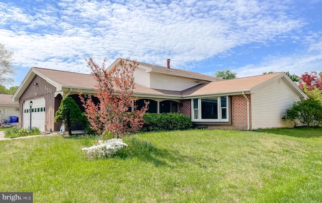 2422 Pinefield Rd, Waldorf, MD 20601 - view of front of home with brick siding, an attached garage, and a front yard