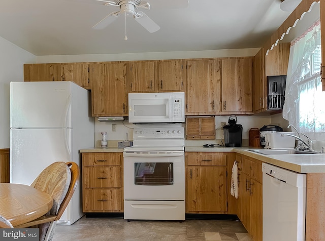 2422 Pinefield Rd, Waldorf, MD 20601 - kitchen with brown cabinetry, a ceiling fan, white appliances, light countertops, and a sink