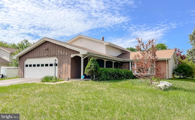 2422 Pinefield Rd, Waldorf, MD 20601 - ranch-style home with a garage, concrete driveway, a front lawn, and brick siding