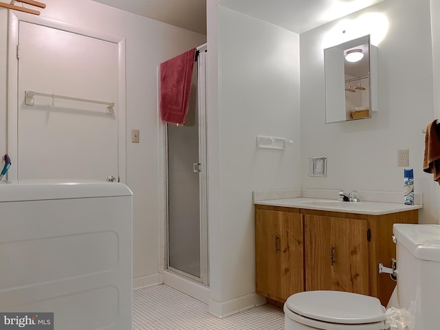 2422 Pinefield Rd, Waldorf, MD 20601 - full bathroom featuring vanity, toilet, washer / clothes dryer, tile patterned floors, and a shower stall