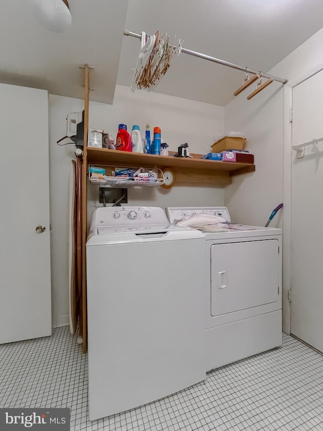 2422 Pinefield Rd, Waldorf, MD 20601 - washroom featuring laundry area, light tile patterned flooring, and independent washer and dryer