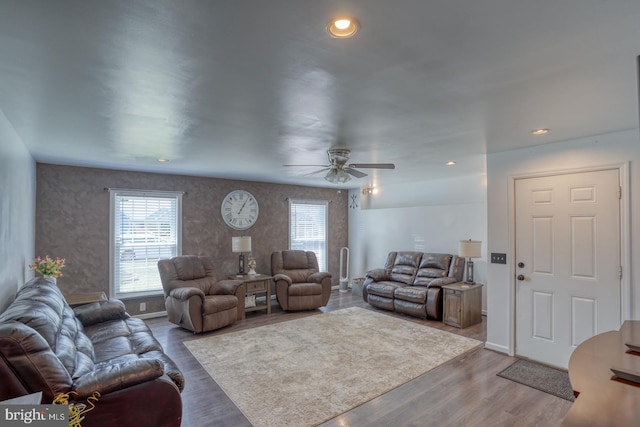living area featuring recessed lighting, ceiling fan, and wood finished floors