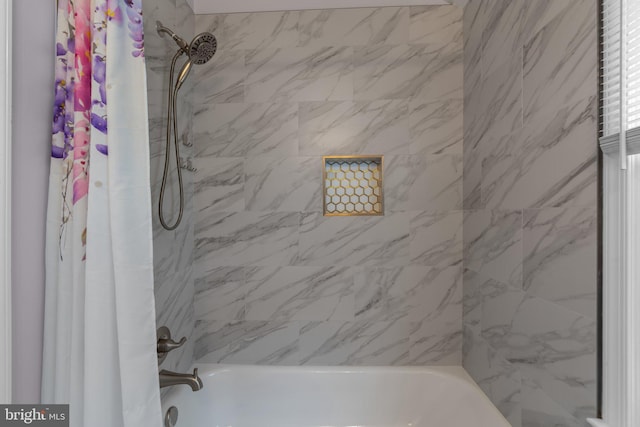 bathroom featuring shower / bath combination with curtain