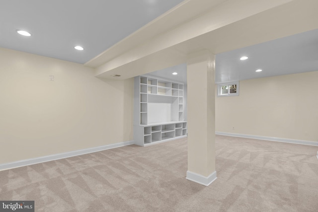 finished below grade area with carpet, baseboards, and recessed lighting
