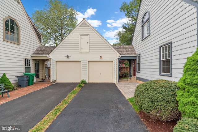 view of front of property with a garage and driveway