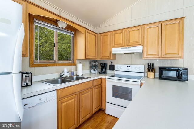 296 Mountainside Rd, Berkeley Springs, WV 25411 - kitchen featuring a sink, light countertops, lofted ceiling, under cabinet range hood, and white appliances