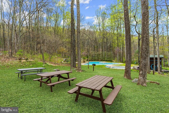 296 Mountainside Rd, Berkeley Springs, WV 25411 - view of community featuring a lawn, a view of trees, and a pool