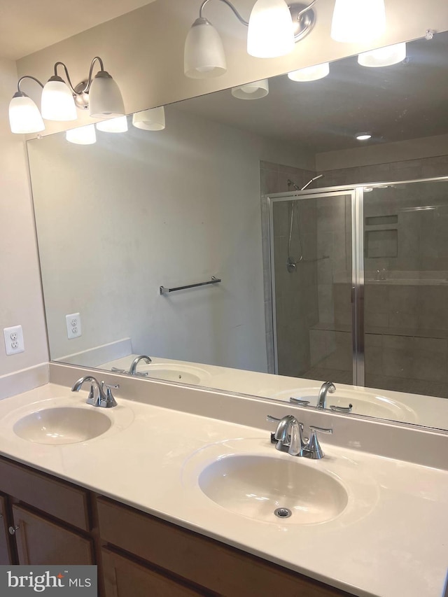full bath with a sink and a stall shower
