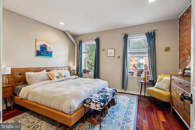 bedroom with recessed lighting and dark wood-style floors
