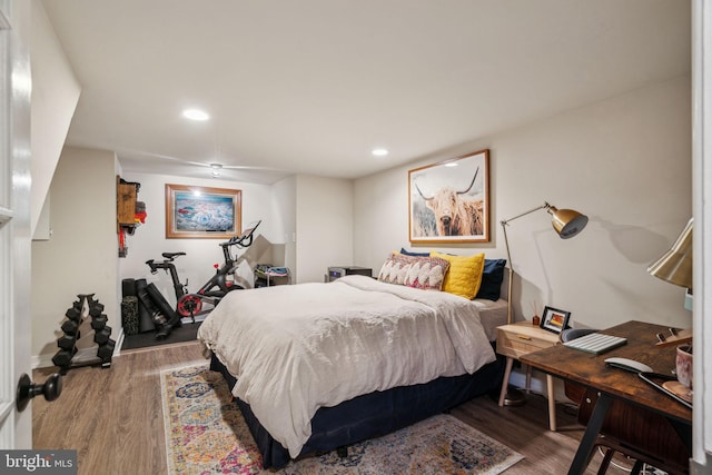 bedroom featuring recessed lighting and wood finished floors