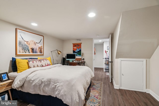 bedroom with recessed lighting, baseboards, and wood finished floors