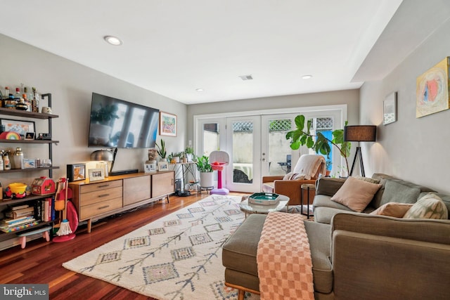 living room featuring recessed lighting, visible vents, french doors, and wood finished floors