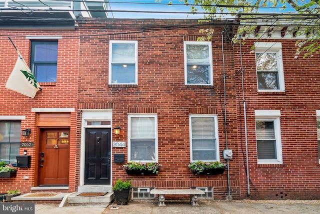 multi unit property featuring brick siding