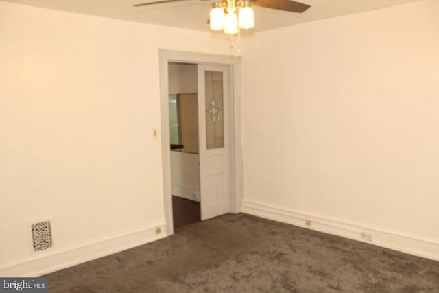 spare room with carpet floors and ceiling fan