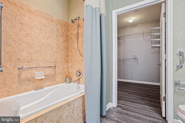 8004 Ink Berry Ct Unit D-3, Pasadena, MD 21122 - bathroom featuring a walk in closet, tiled shower / bath, and wood finished floors