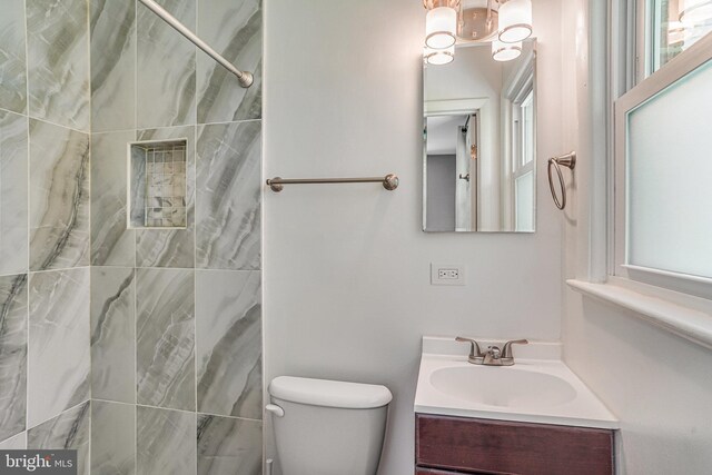 4001 Patricia St, Annandale, VA 22003 - full bathroom featuring vanity, a tile shower, toilet, and a chandelier