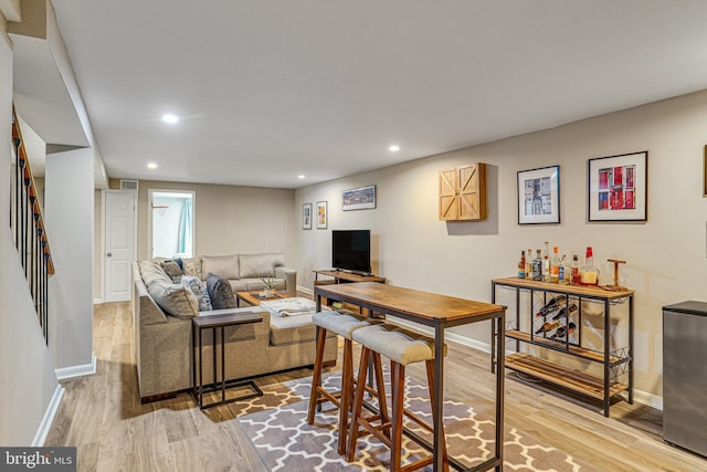 4001 Patricia St, Annandale, VA 22003 - living room with recessed lighting, baseboards, wood finished floors, and stairway