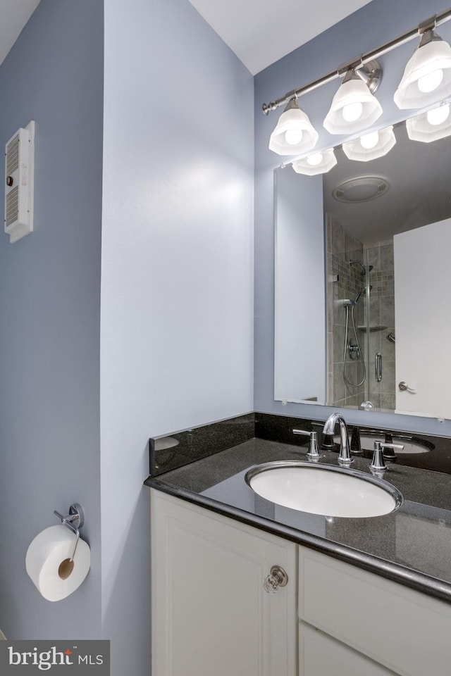 bathroom with vanity and a stall shower