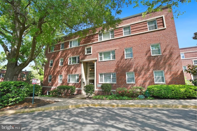 townhome / multi-family property with brick siding