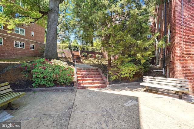 view of yard with stairs and a patio