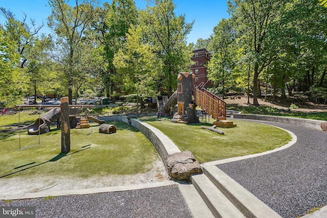 community jungle gym featuring a yard