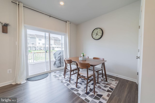 dining area featuring baseboards and wood finished floors
