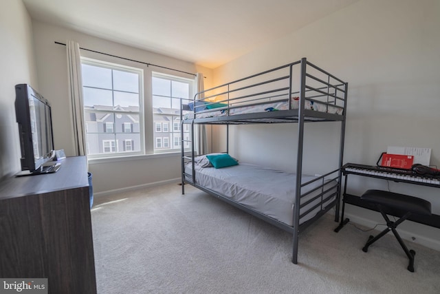 carpeted bedroom with baseboards