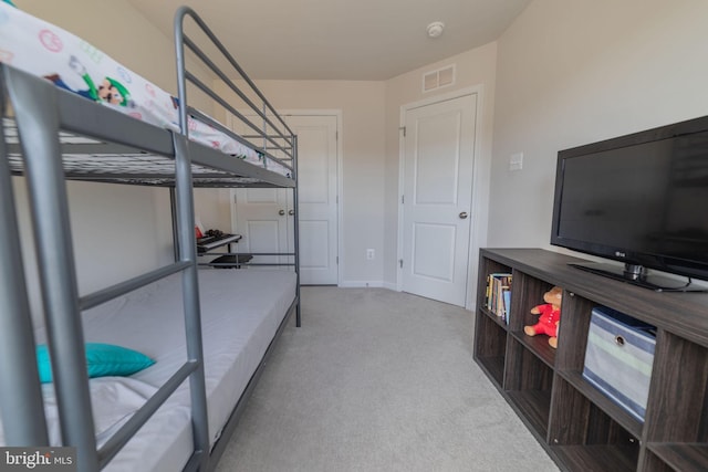 bedroom with baseboards, carpet, and visible vents