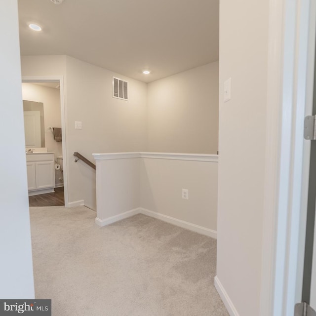 interior space featuring visible vents, carpet flooring, baseboards, and recessed lighting