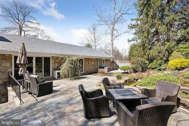 view of patio / terrace featuring a fire pit