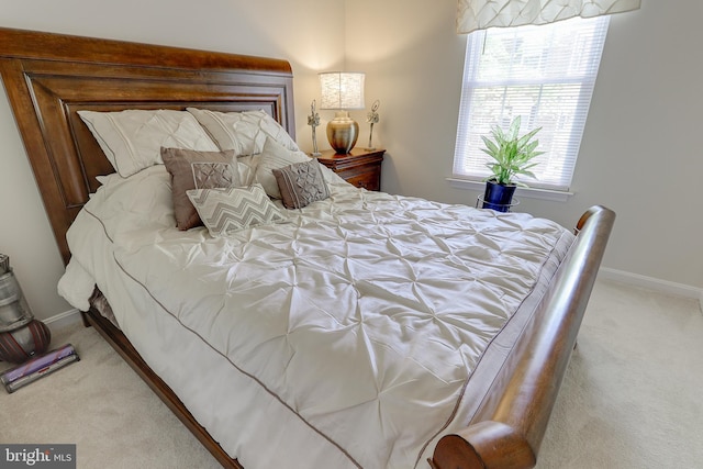 bedroom with baseboards and carpet flooring
