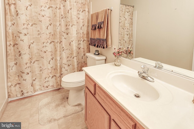 full bathroom featuring toilet, tile patterned floors, curtained shower, and vanity