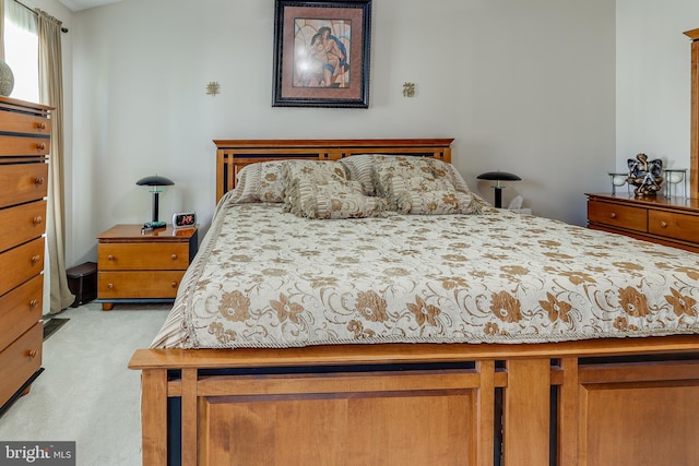 bedroom with light colored carpet