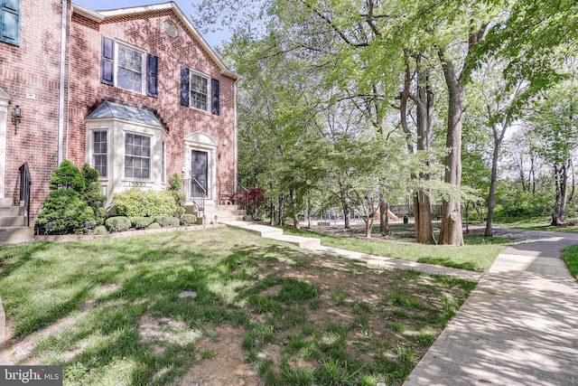 view of front of house with brick siding