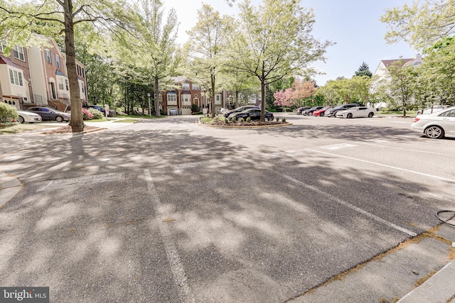 view of street with a residential view and curbs