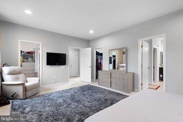 bedroom featuring a closet, recessed lighting, and a spacious closet