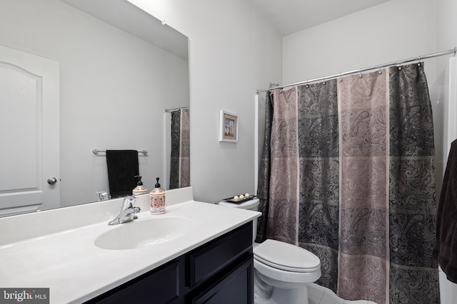 full bathroom with vanity, tile patterned flooring, and toilet
