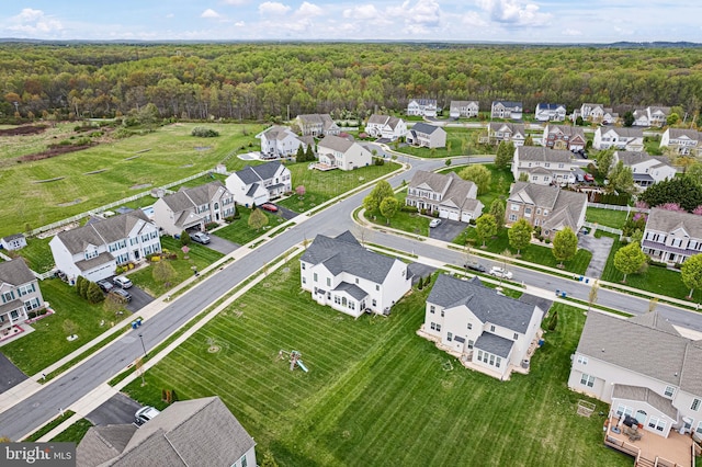aerial view featuring a view of trees and a residential view