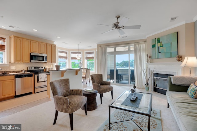 living room featuring a wealth of natural light and visible vents