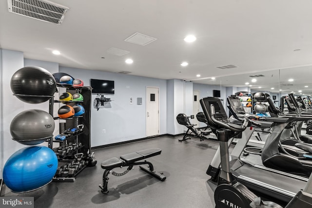 workout area featuring recessed lighting and visible vents