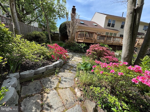 view of yard featuring a deck and fence