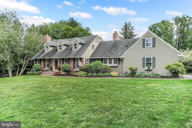 318 Longwood Rd, Kennett Square, PA 19348 - cape cod home with a chimney, a front yard, covered porch, and brick siding