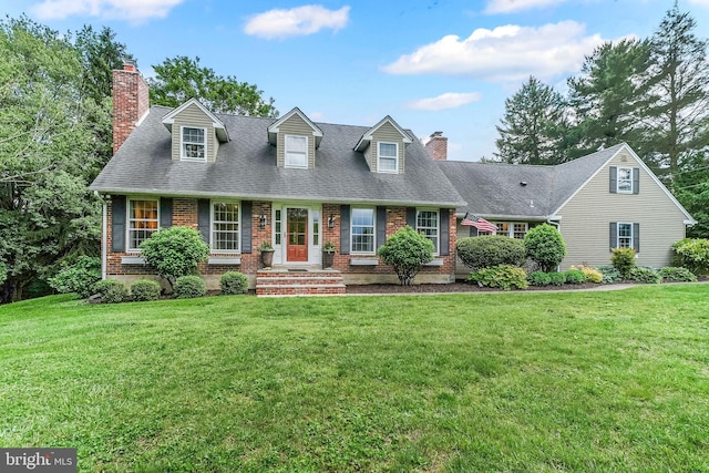 318 Longwood Rd, Kennett Square, PA 19348 - new england style home featuring brick siding, a chimney, and a front lawn