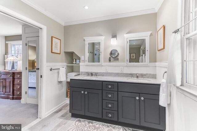 318 Longwood Rd, Kennett Square, PA 19348 - bathroom with double vanity, crown molding, wainscoting, and wood finished floors