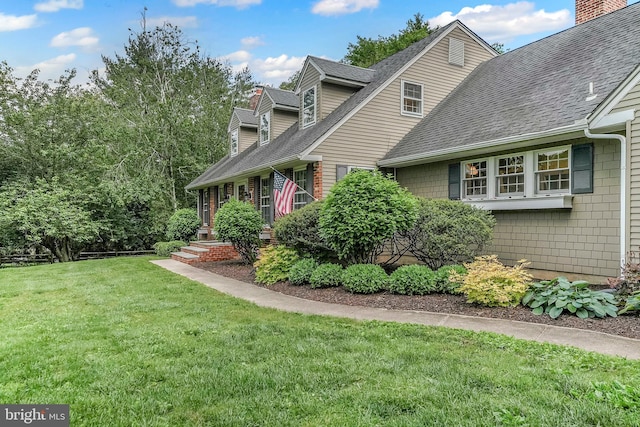 318 Longwood Rd, Kennett Square, PA 19348 - view of side of home featuring roof with shingles and a lawn