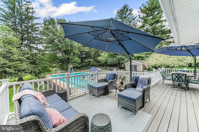 318 Longwood Rd, Kennett Square, PA 19348 - wooden terrace featuring an outdoor pool, outdoor dining space, and view of scattered trees